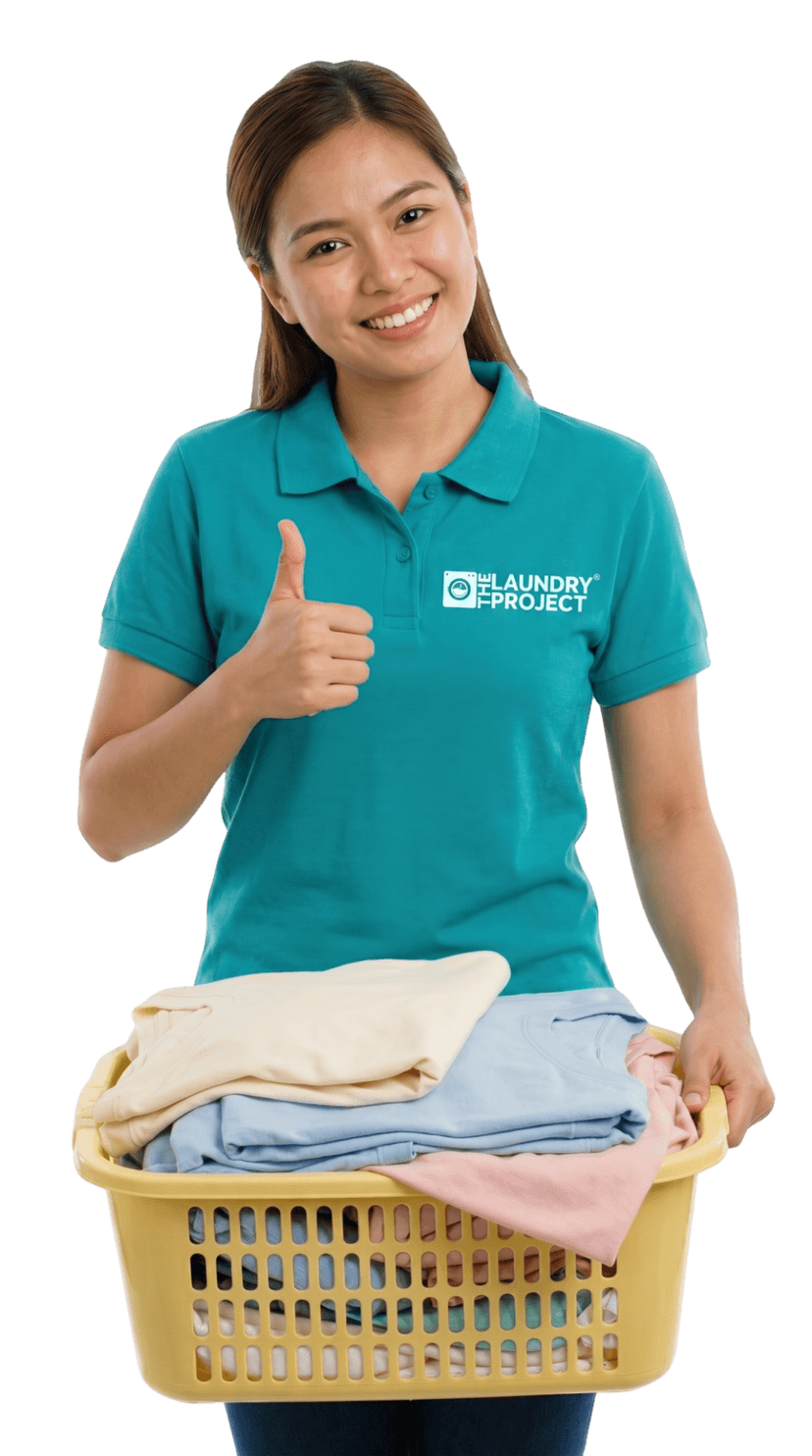 Laundry Project staff with freshly cleaned laundry